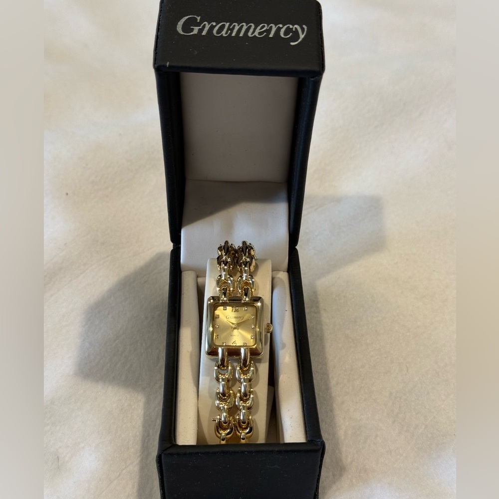 Gramercy Watch Gold NIB May need to Replace Battery Still has plastic on see pic